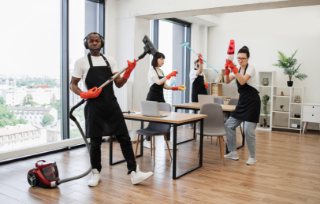 african-man-with-modern-vacuum-cleaner-three-cleaners-dancing